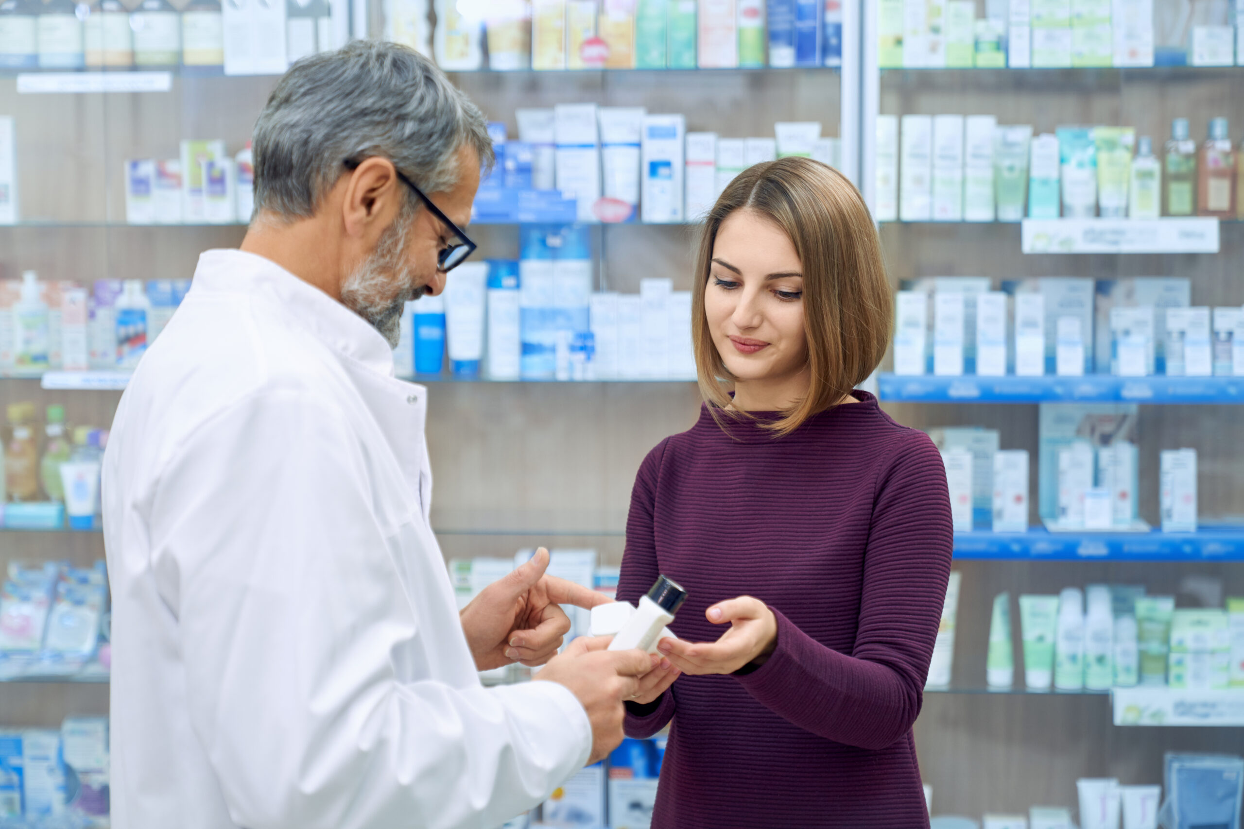 pharmacist helping woman medicine choice scaled